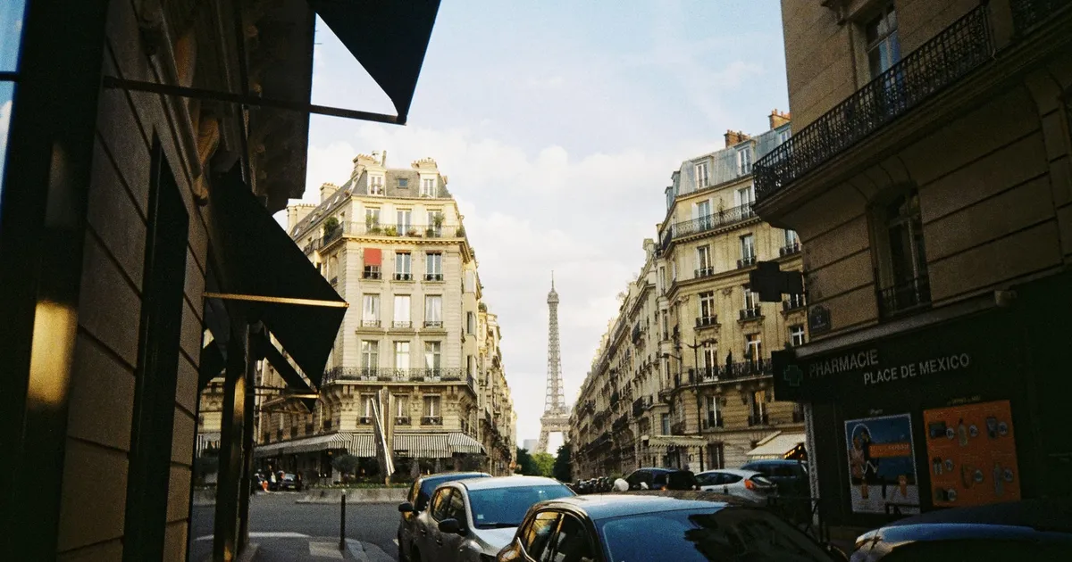 A Paris street with the Eiffel Tower in the distance