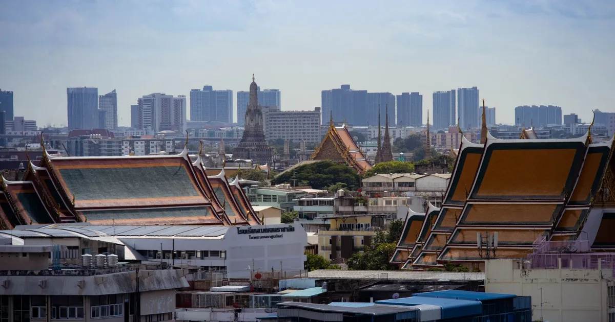 The Bangkok skyline with traditional Thai architecture