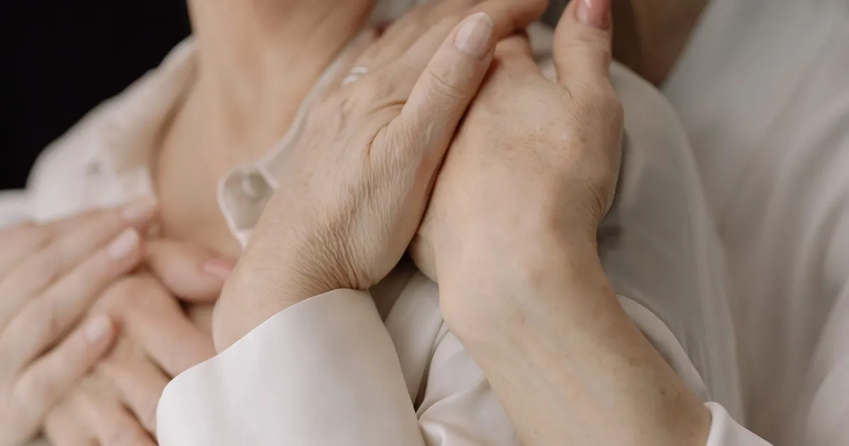 Close-up of two elderly people's hands