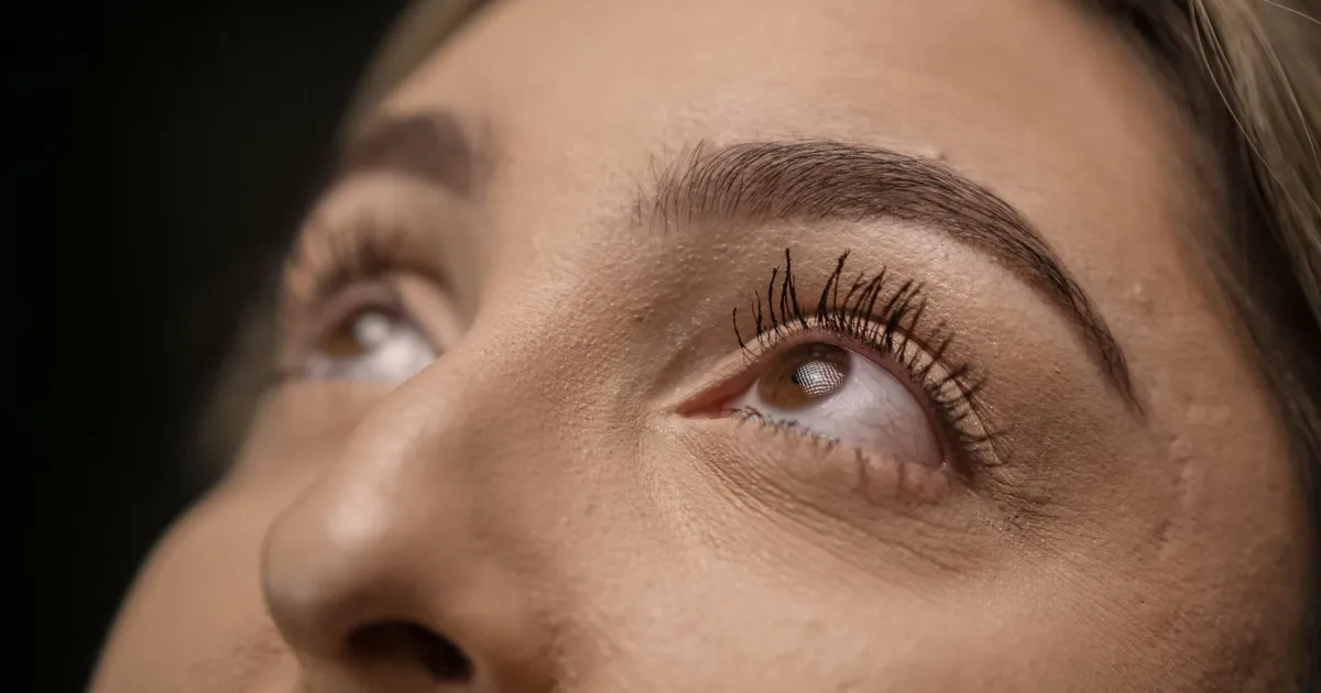 Extreme close-up of eyes looking upward with long eyelashes