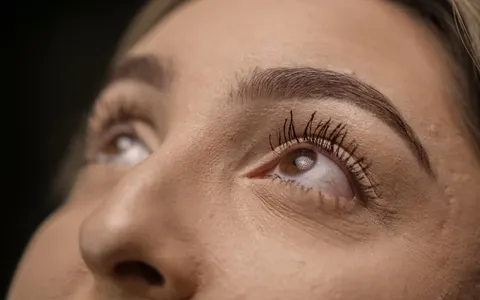 Extreme close-up of eyes looking upward with long eyelashes