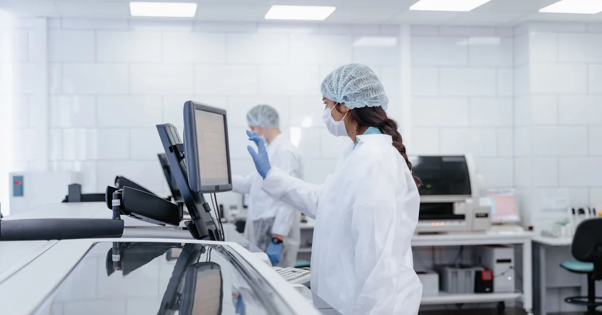 Technicians working in a pharmaceutical compounding laboratory