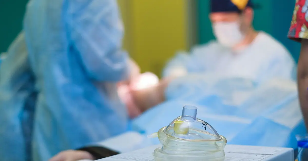 Medical team performing surgery in a sterile hospital operating room