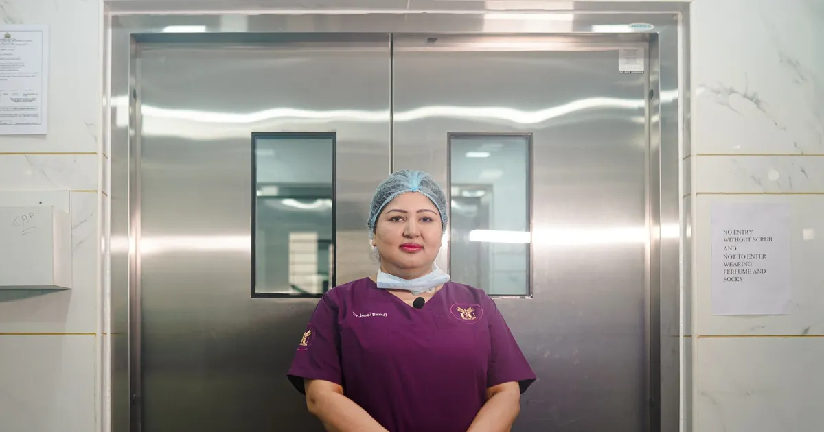 A healthcare professional in a hospital corridor
