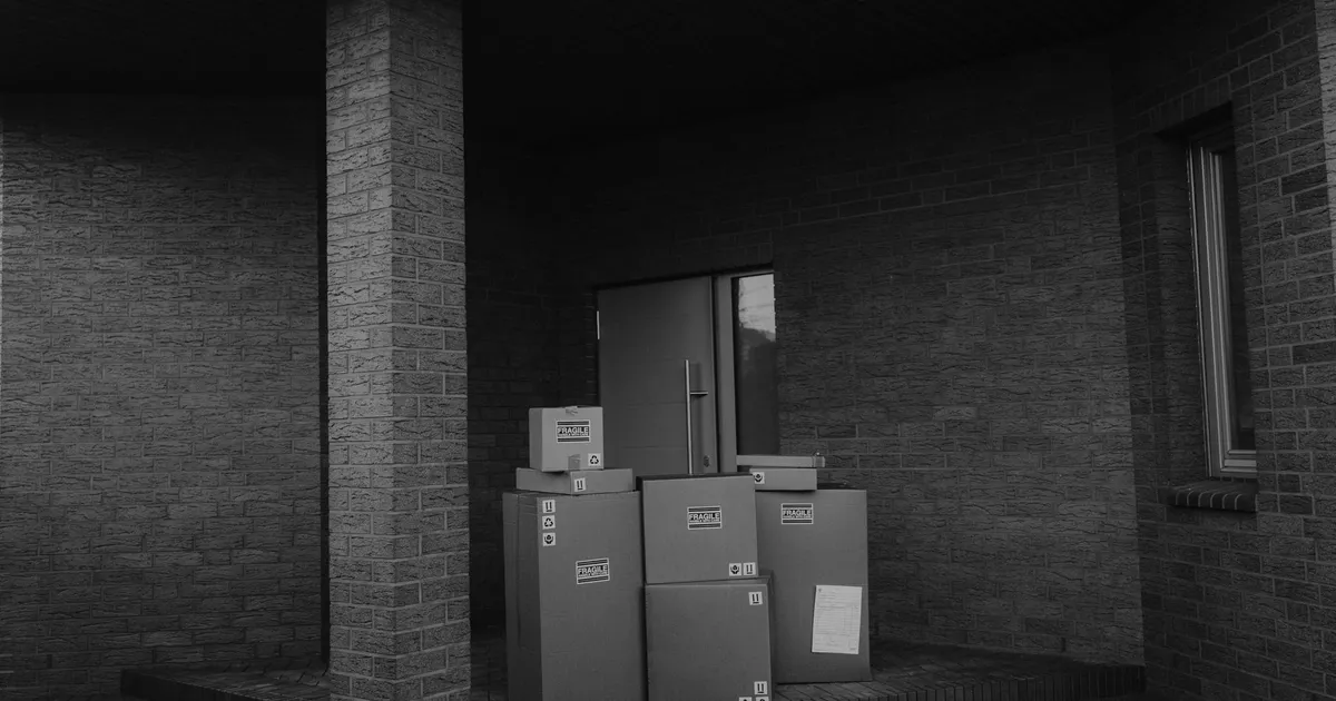 Parcels stacked at a doorway