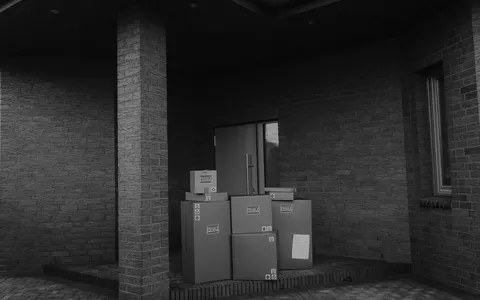 Parcels stacked at a doorway