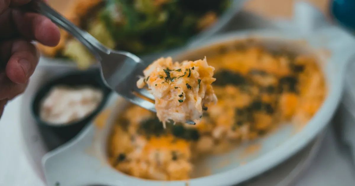 A forkful of pasta with herbs