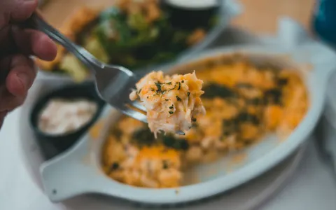 A forkful of pasta with herbs